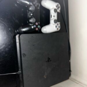 Sony PlayStation 4 Console with Black and White Controllers